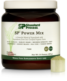 Tub of SP Power Mix next to a scoop of the green powder.